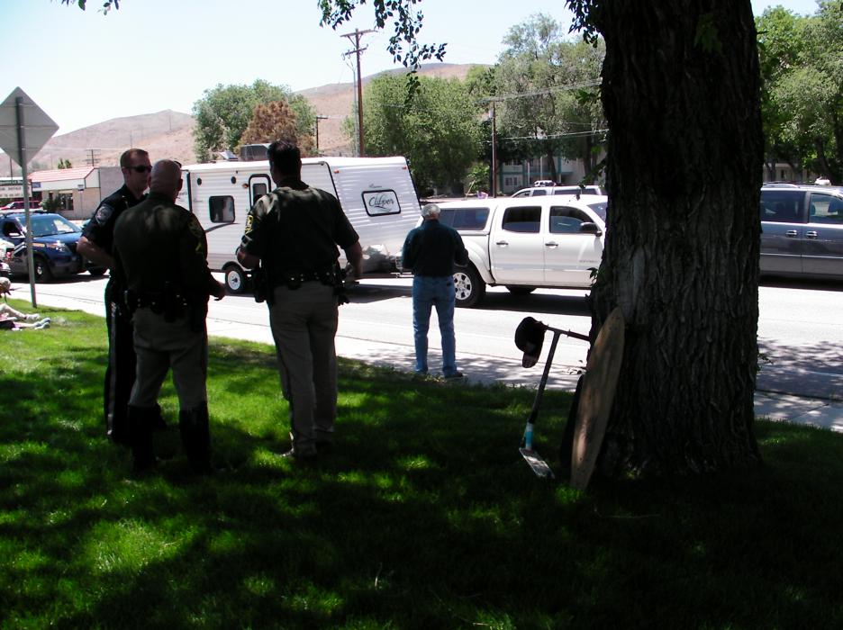 Carson City deputies and NHP officers at the scene of an accident involving a scooter. 