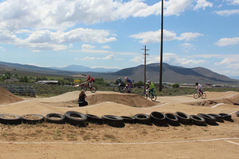 A large group of riders race to see who will make it to the final race.