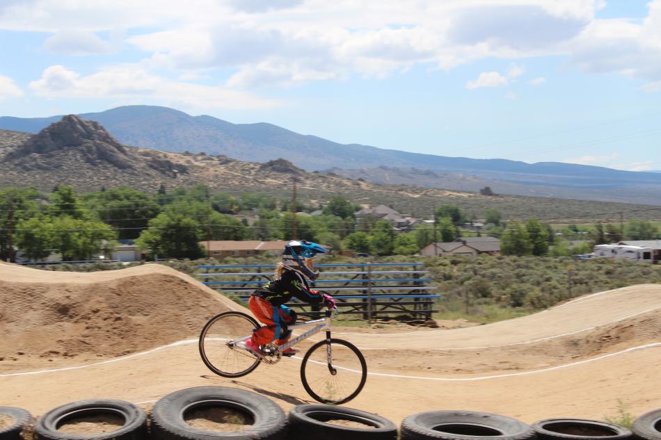 A young rider pedals hard to finish the race.
