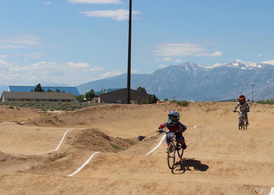 Riders pedal over the small humps at the end of the race.