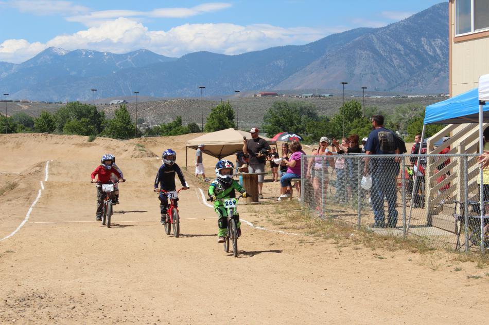 Three riders finish the race neck and neck.