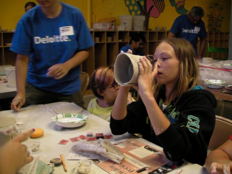 Paris Fletcher, 11, of Carson City works the clay at the Children's Museum on Friday.