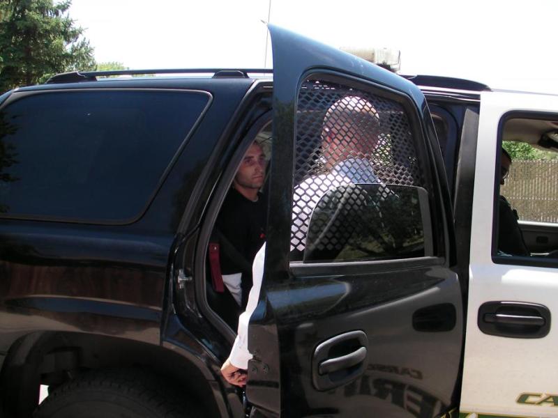 Jac Owen, 24, was placed into custody on a felony warrant charge and is a person of interest in a June 1 armed robbery.