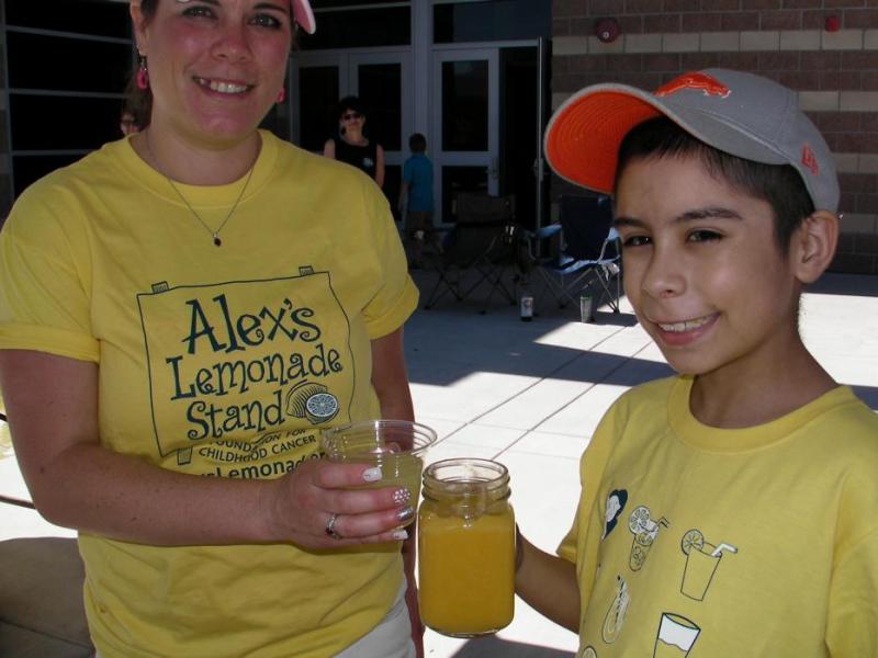 Athena and Anthony Cox give a lemonade toast at the Boys and Girls Club in Carson City.