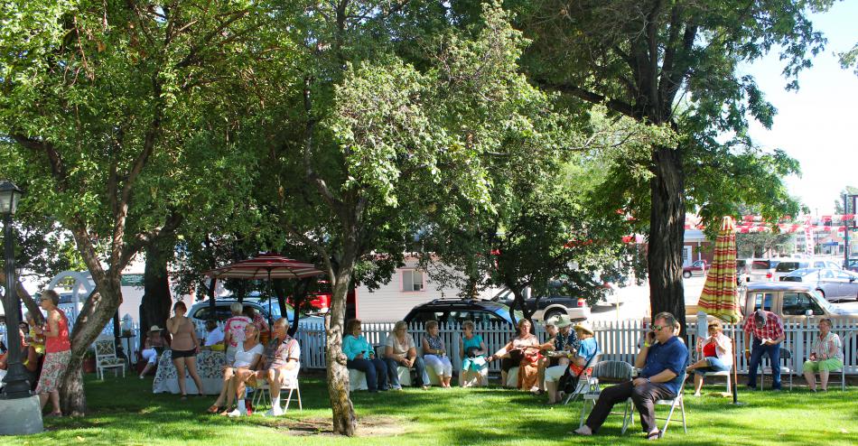 Guests find a spot on the Foreman-Roberts House Museum lawn to listen to music and mingle