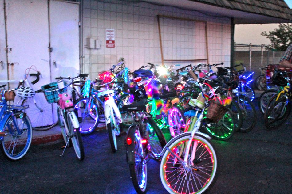 Bikes adorned with flashing lights parked outside The Feisty Goat.