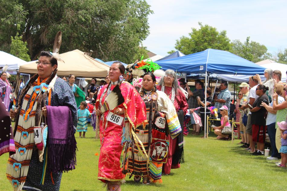 Women dancers dance gracefully into the school campus