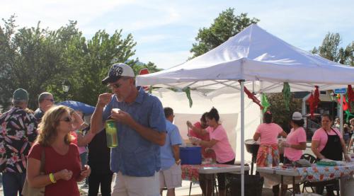 A couple enjoys tamales courtesy of the Tamale Lady.