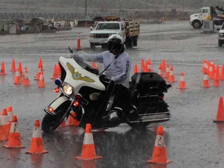 Carson City sheriff's Motor Patrol Deputy Gary Denham practices in the rain.
