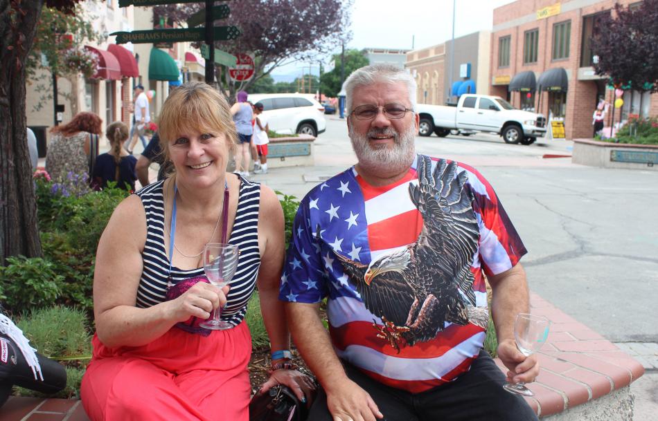 Leni Manning and Randy Michalek dress in festive 4th of July wear while enjoying their wine.