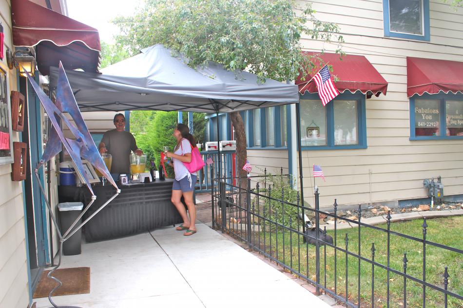 Artsy Fartsy Art Gallery show off their patriotism with American flags lining their fence.