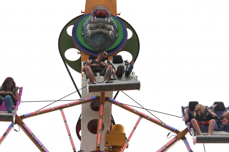 Dad comforts his son on the ferris wheel.
