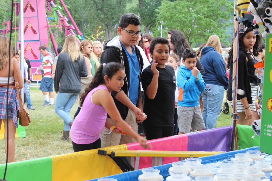 Three siblings take their chances to win a toy they've been eyeing.