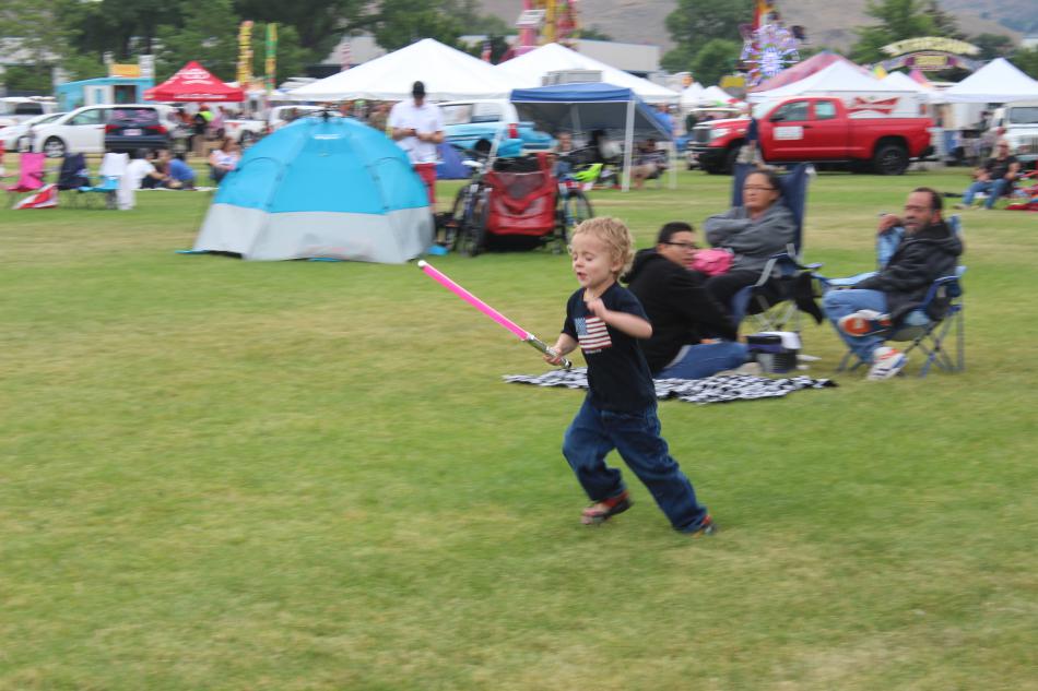 Ziah Lampe,4, speeds around their camp cutting down imaginary bad guys.