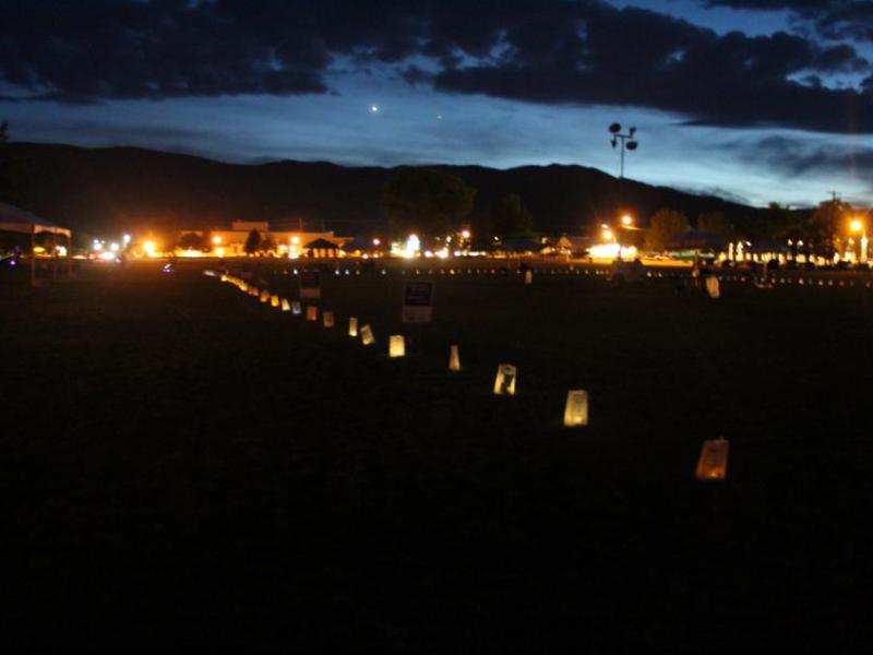 Luminarias line the Mill's Park track