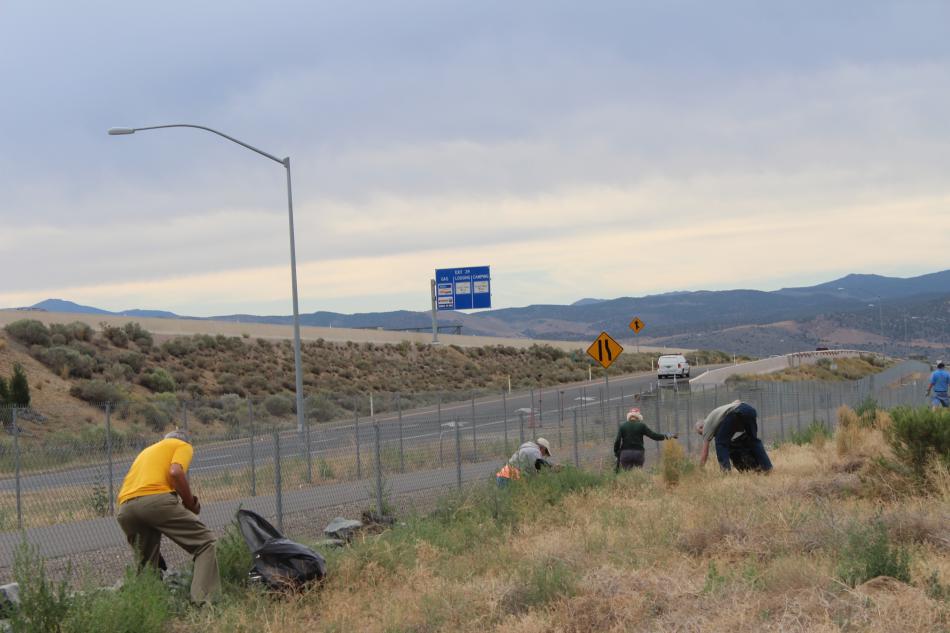 Trash mob volunteers scan the area for trash.