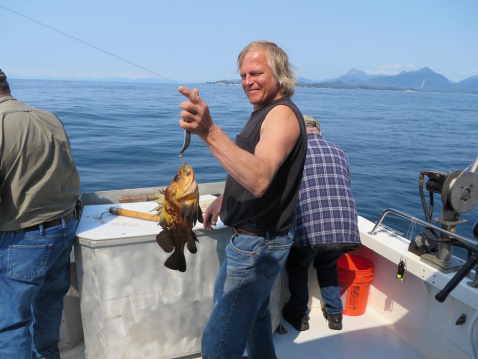 Captain Terry with another bottom fish.   Photo by Elaine Quilici