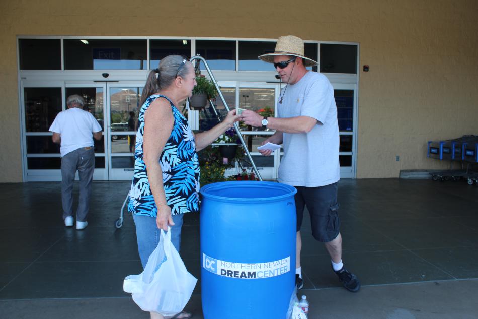 Scott Harris collects a cash donation