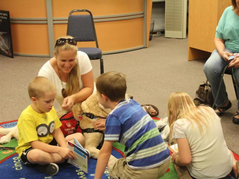 Children enjoyed petting dogs and reading books