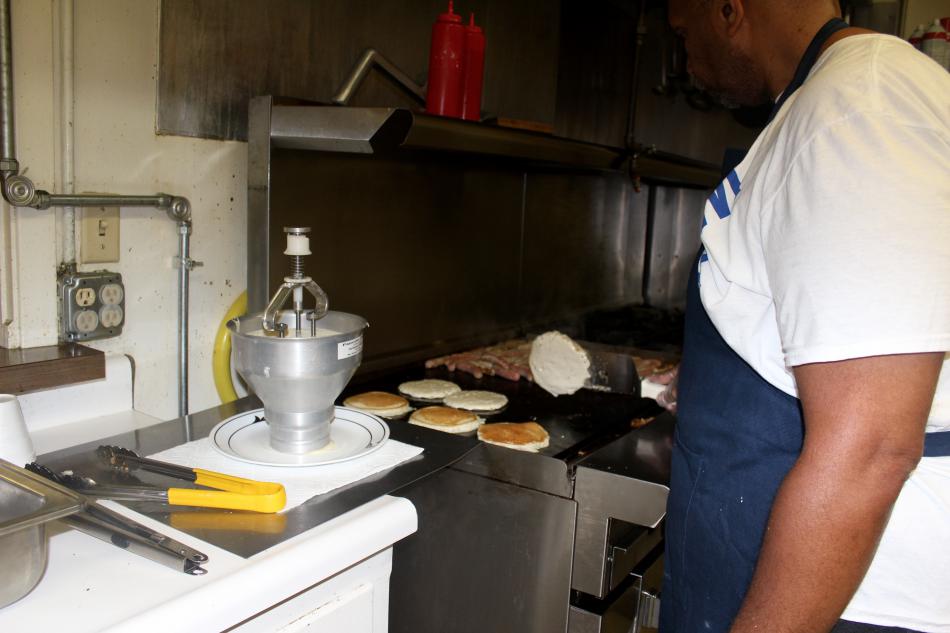 Robert Vicks cooks pancakes and sausages