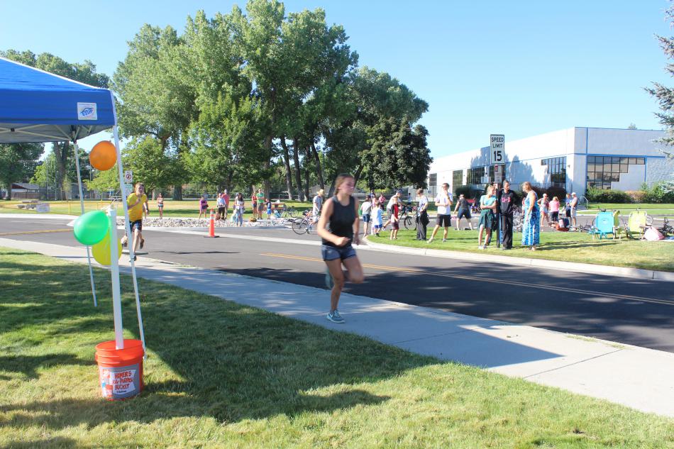 Runners continue along the 1.3 mile bike ride