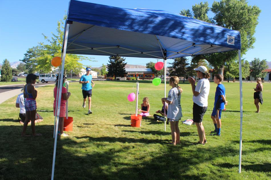 Kids coming in ready for their medal and a drink of water
