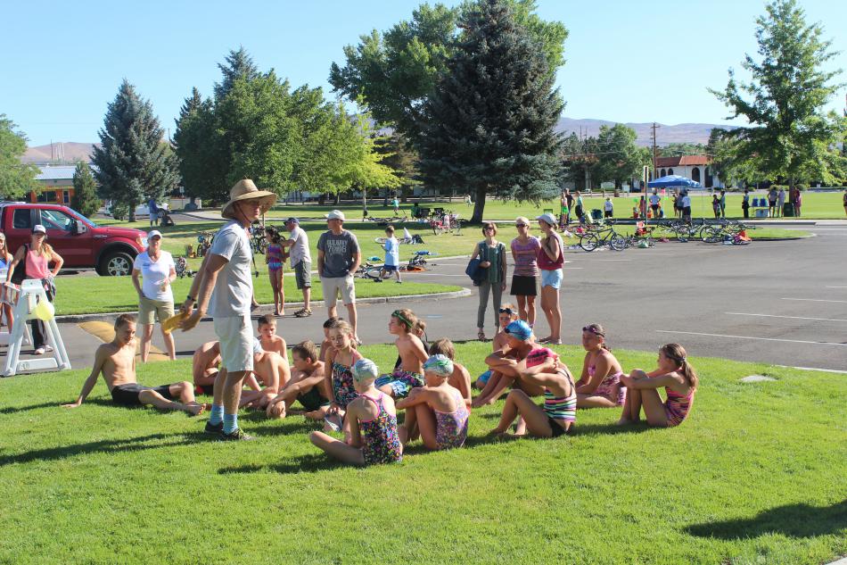 The 11 to 12 age group get the race instructions before beginning the swim portion