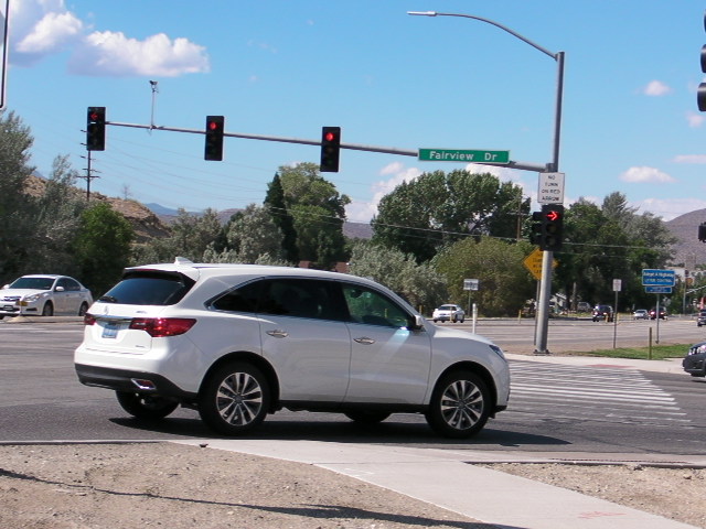 A motorist goes through a red arrow right turn at Fairview and South Carson Street.