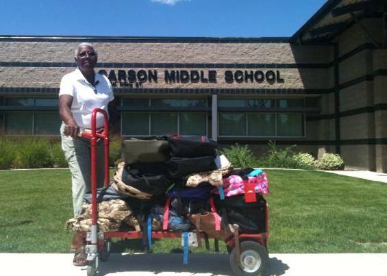 Mary Luster brings backpacks collected last year to Carson Middle School.