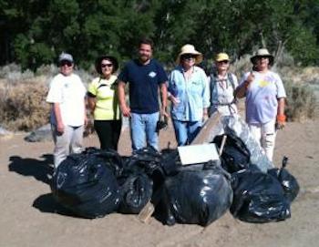 Local Carson City residents remove trash from the east side of the Carson River.