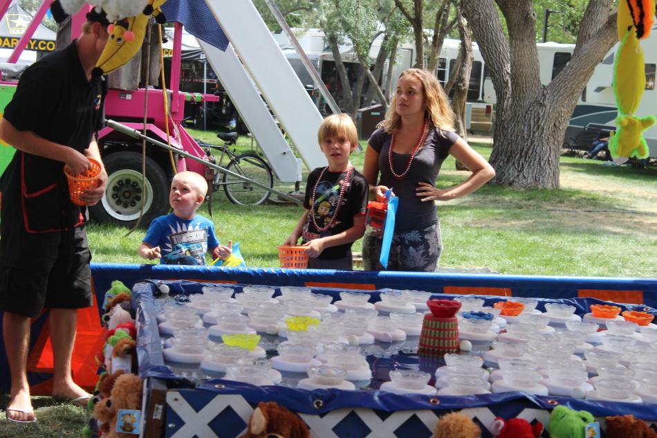 Kids attempt to win a prize at the Buoy Pitch game