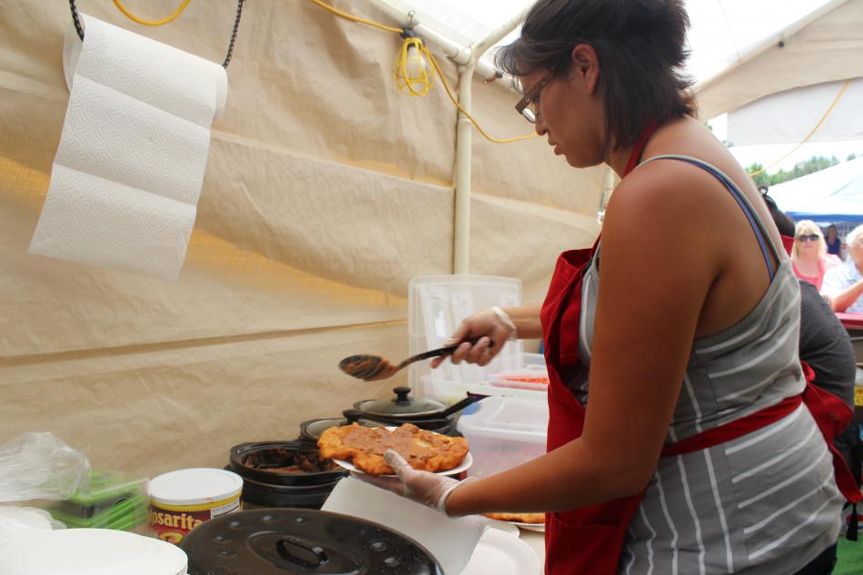 Ladies from JD's prepare indian tacos for hungry guests