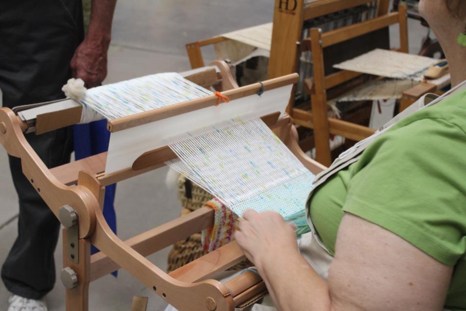 Anne weaves a soft colored piece