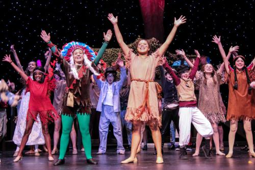 Alexa Haight as Peter Pan, Serena Dantzler as Tiger Lily with the Lost Boys and Natives. Photo by Angila Golik of Golik Photogra