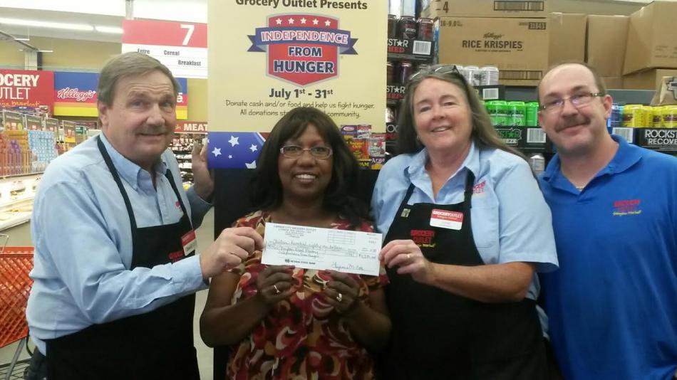Grocery Outlet in Carson City gives cash and food to Dayton Food Pantry during July Independence From Hunger drive.