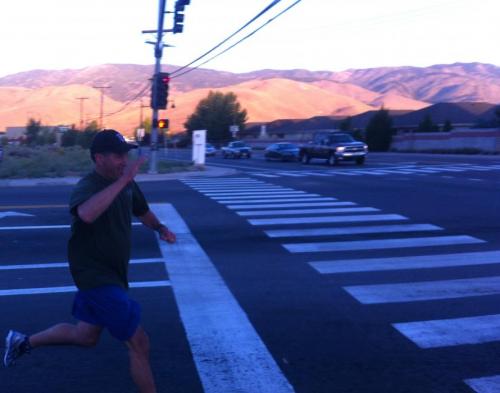Nevada Gov. Brian Sandoval salutes while making the turn at Fairview Drive in Carson City at last year's run.
