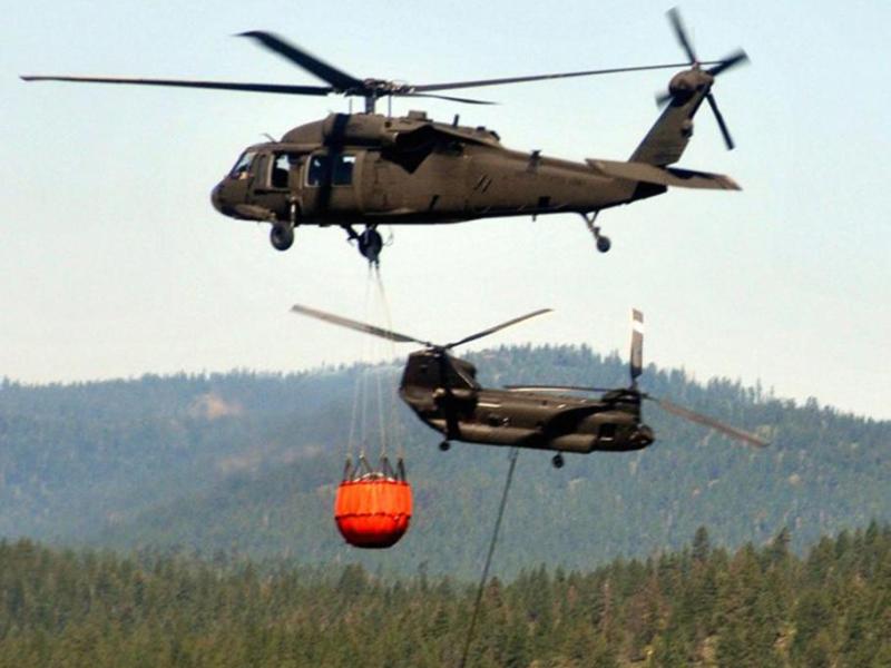 In this file photo, crews aboard one Nevada Army Guard UH-60 Black Hawk helicopter. Photo by Tech Sgt. Emerson Marcus