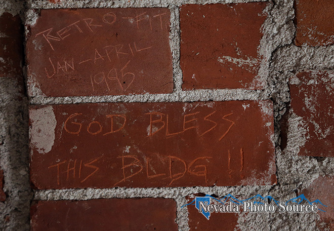 Dozens of signatures and messages cover the walls of the clock tower. Cathleen Allison, Nevada Photo Source