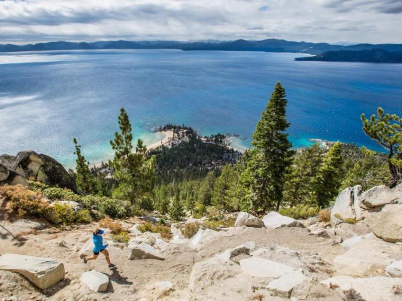 A woman runs along the Lake Tahoe Flume Trail. Photo by Scott Rokis, Scott Rokis Photography