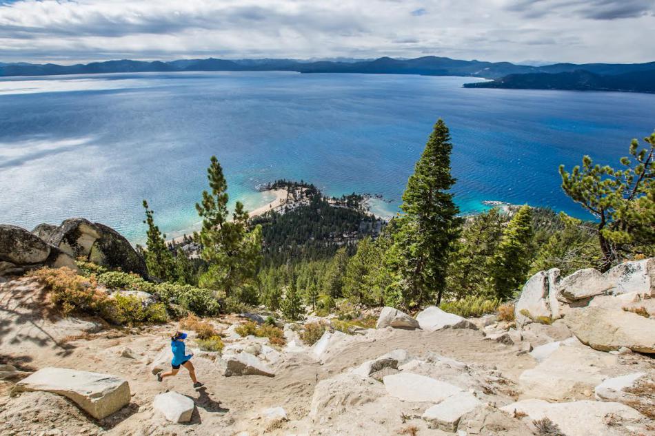 A woman runs along the Lake Tahoe Flume Trail. Photo by Scott Rokis, Scott Rokis Photography