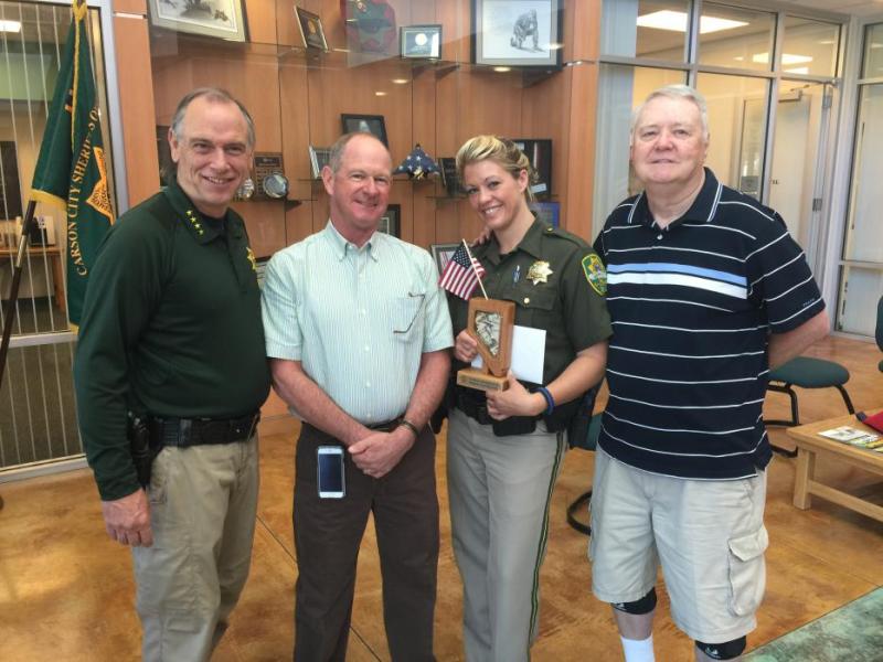 Downtown Coin Club donation from left to right: Sheriff Ken Furlong, Pete Onorato, Deputy Jessica Dickey and Chuck Price.