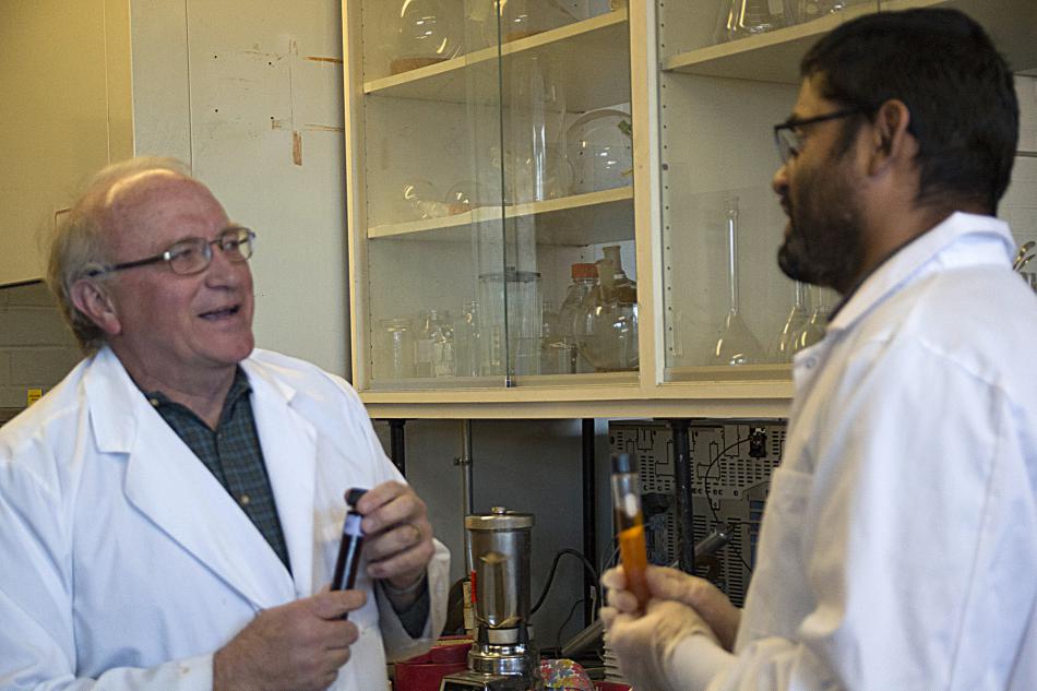 Glenn Miller and Bishnu Neupane holding the final biofuel product based on the gumweed plant. 