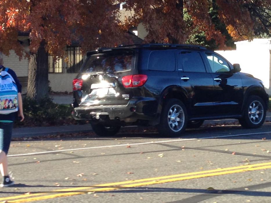 The black Toyota SUV that was hit while stopped to turn left on Glenbrook Circle.