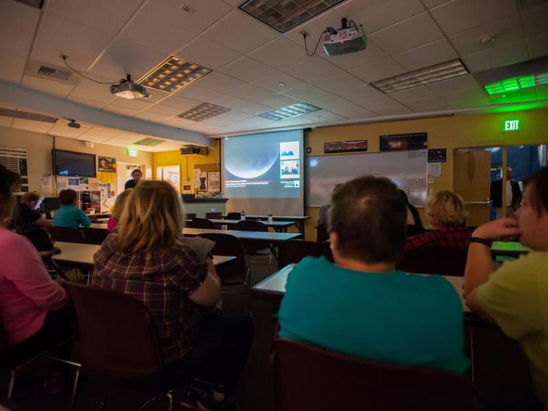 Visitors at the Jack C. Davis Observatory at Western Nevada College watch a live stream of the supermoon eclipse Sept. 27, 2015.
