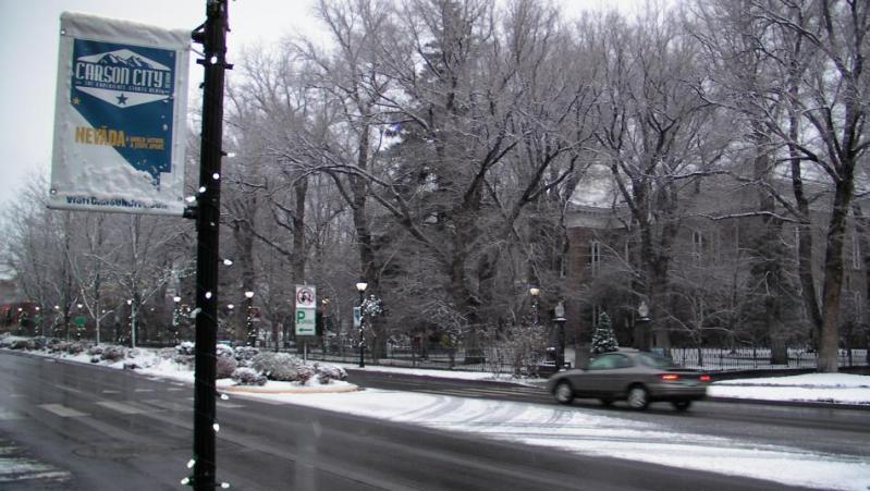 Morning commuters go past the Nevada State Capitol building Friday morning.