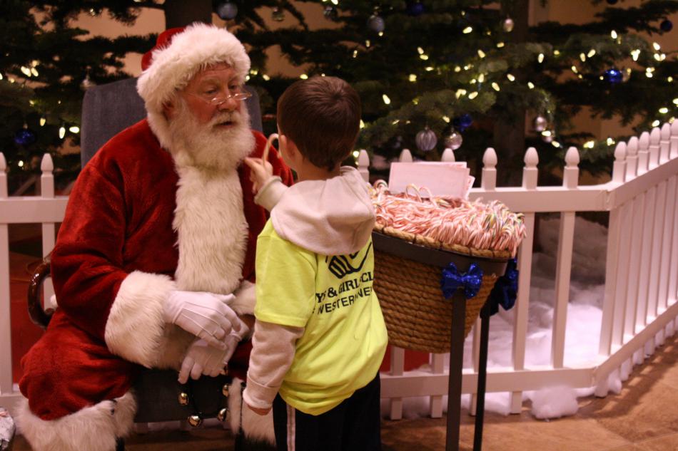 Is it real? Santa’s beard gets a tweak at the Carson Tahoe Health annual Kids Christmas Party.