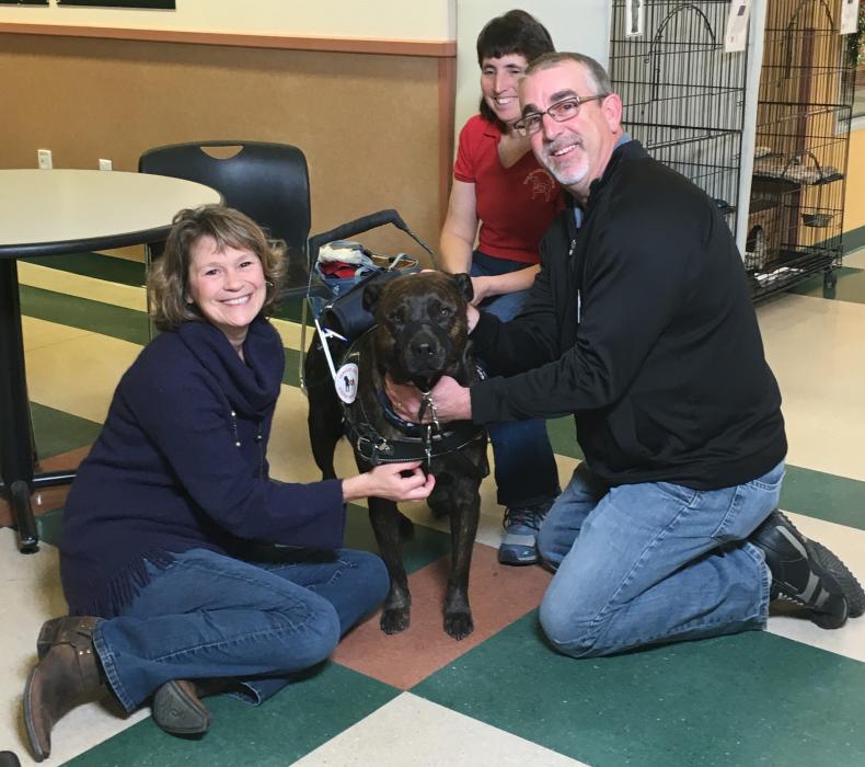 LtR: Suzanne Kogot, Executive Director Petco Foundation, dog Brindy, adopter Linda Hibbard and Brian Houchins, district manager.