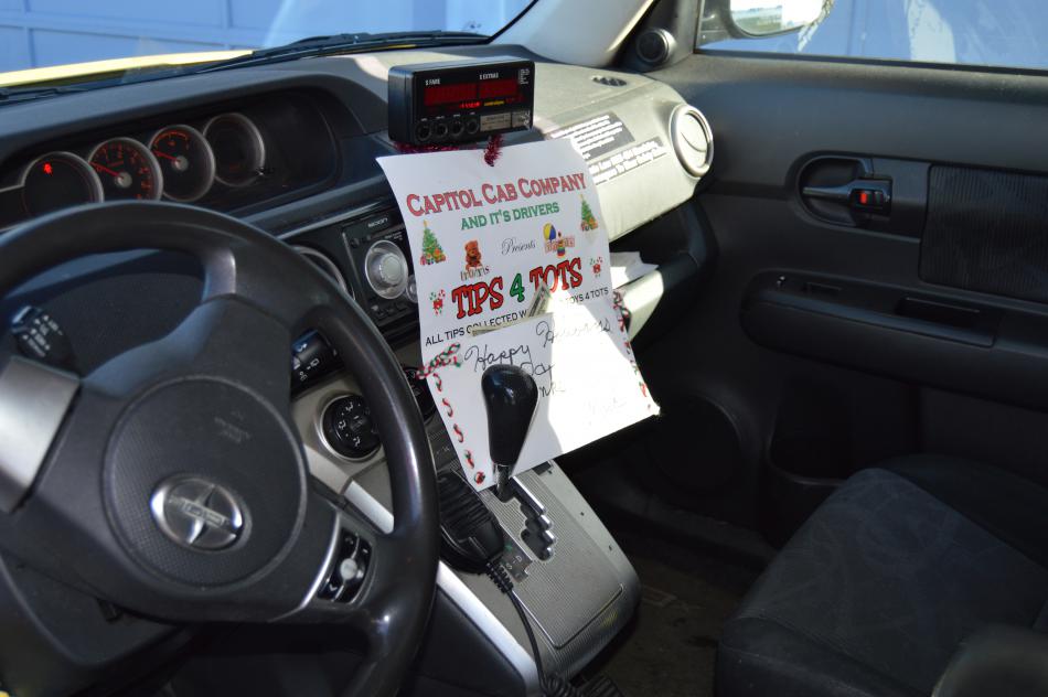 The cab of Mark Shepler's taxicab, displaying his support for Toys For Tots