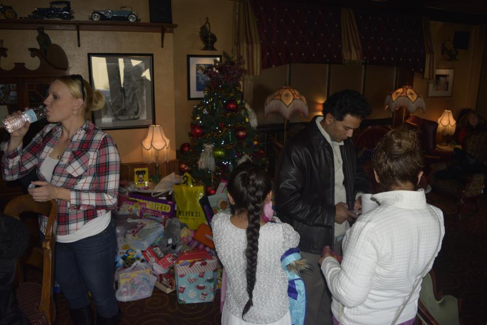 Presents build up around Adele's Christmas tree