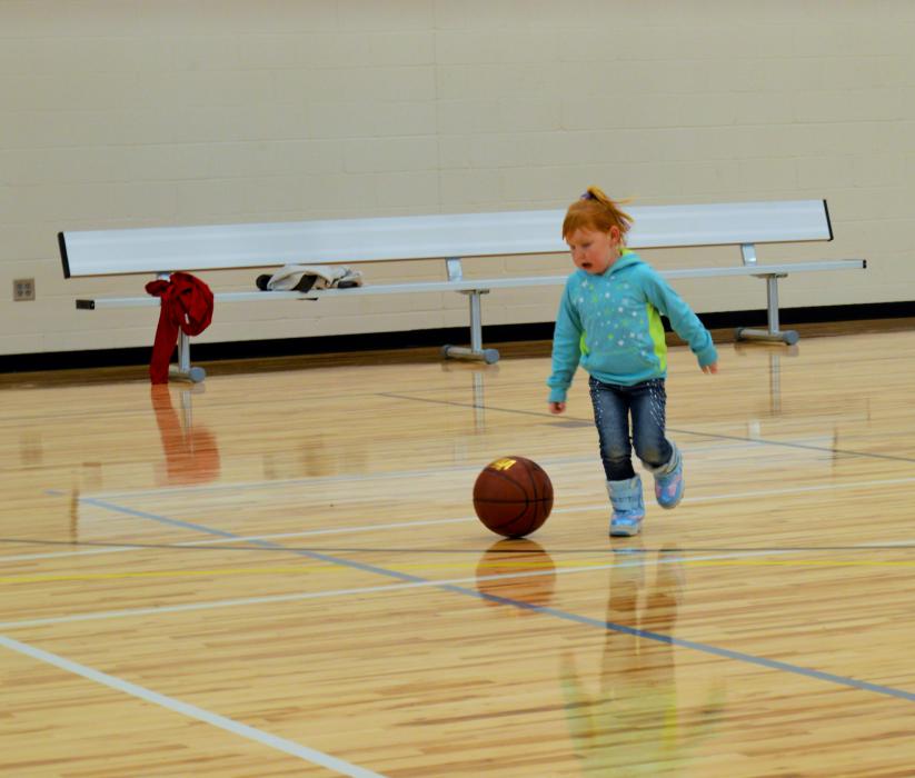 Little basketball player on the court of the new MAC
